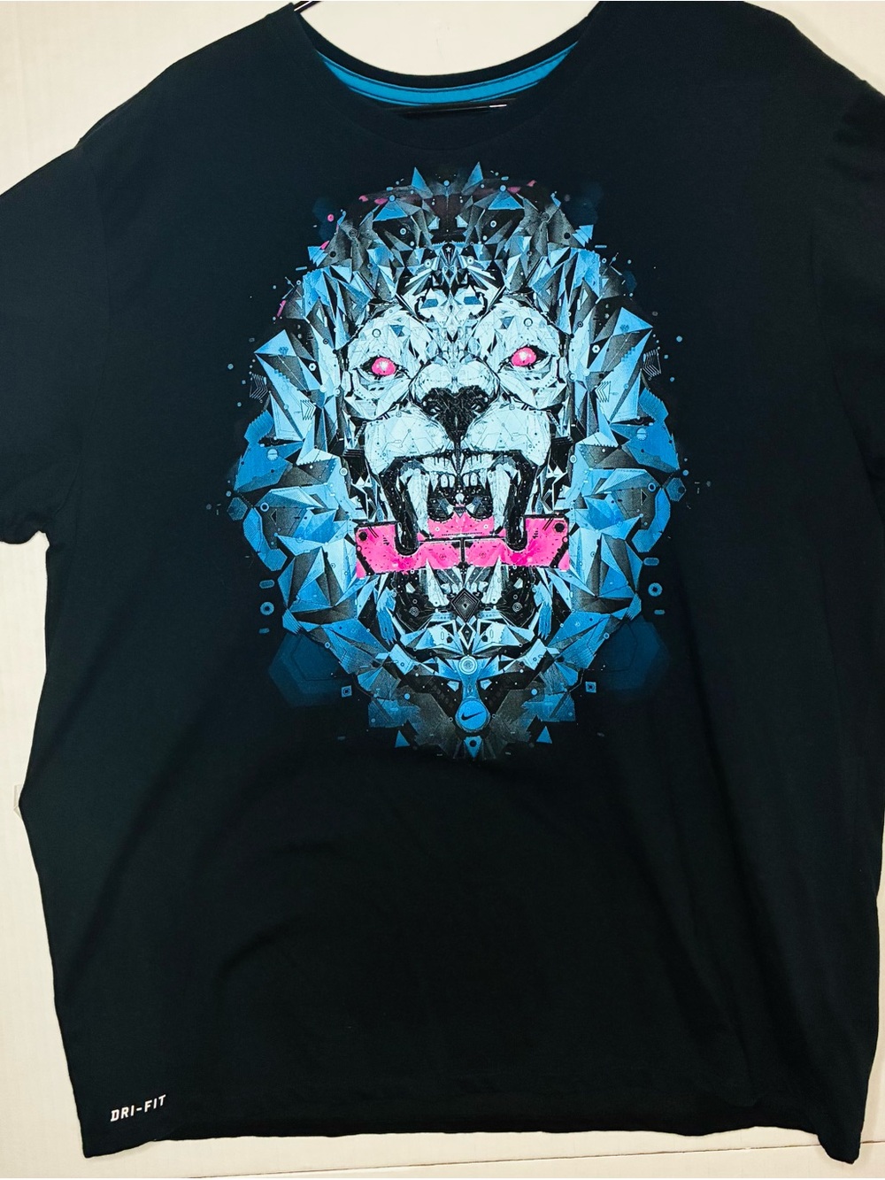 Nike Black Short Sleeve Tee with Blue Geometric Lion and Pink Accents